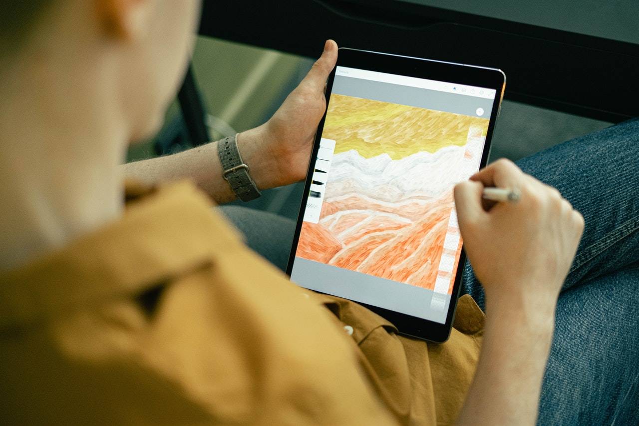 a man using an iPad -  Darren Yaw Foo Hoe